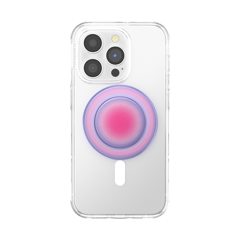  A smartphone with a clear case is shown with an Aura PopGrip for MagSafe attached to its back. The PopGrip features a round, flat surface with a gradient color pattern transitioning from pink in the center to purple on the edges, positioned centrally on the phone's back. The phone's camera lenses are visible at the top, highlighting the PopGrip's stylish and colorful design, which complements the phone's aesthetics while providing a functional grip.