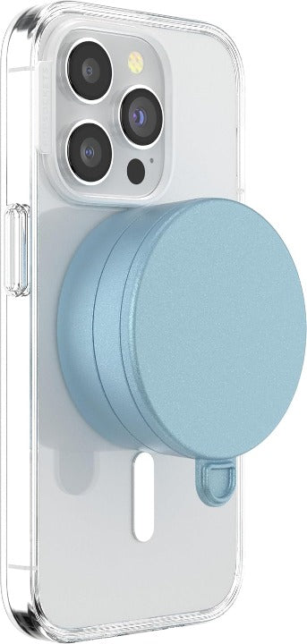 A smartphone with a clear case is shown with a blue sigh PopSockets Suction Mount for MagSafe attached to its back. The mount is securely positioned in the center of the phone's back, demonstrating its compatibility and ease of use with MagSafe technology. The phone's camera lenses are visible at the top, emphasizing the mount's unobtrusive and stylish design.