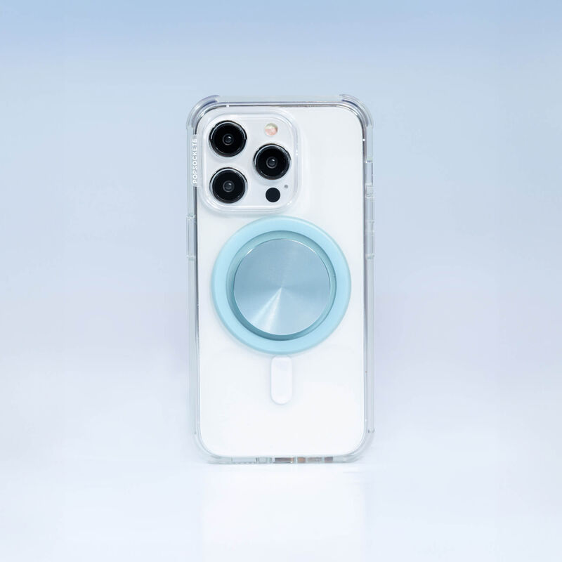 A smartphone with a clear case is shown with a PopSockets MagSafe PopGrip in blue sigh color attached to its back. The PopGrip features a glossy, slightly reflective soft blue surface, positioned centrally on the phone's back. The phone's camera lenses are visible at the top, highlighting the PopGrip's sleek and modern design, which complements the phone's aesthetics while providing a functional grip.