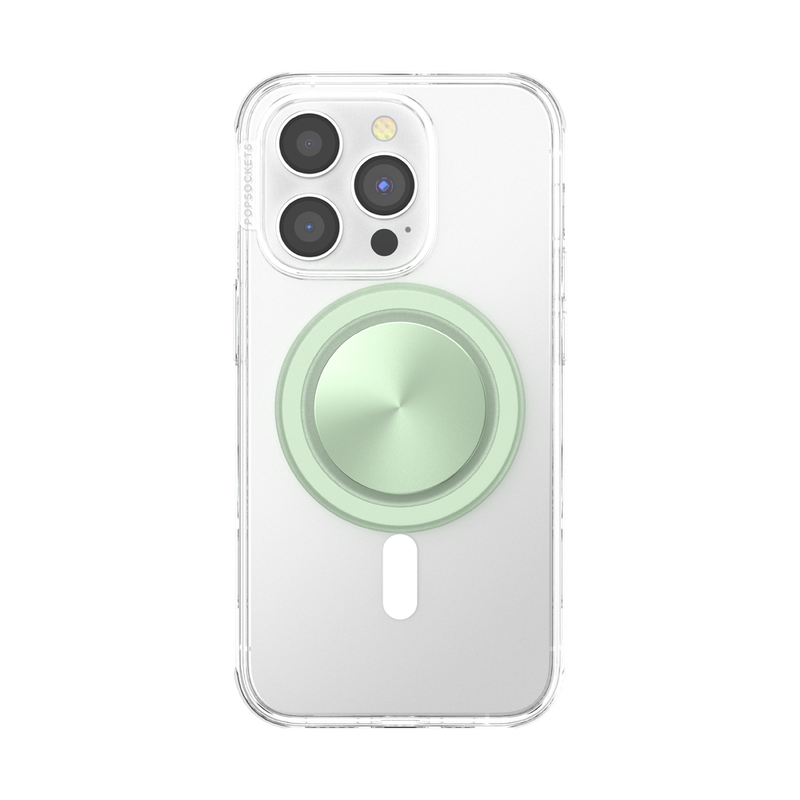  A smartphone with a clear case is shown with a French Navy PopGrip for MagSafe in honey dew color attached to its back. The PopGrip features a glossy, slightly reflective soft green surface, positioned centrally on the phone's back. The phone's camera lenses are visible at the top, highlighting the PopGrip's sleek and modern design, which complements the phone's aesthetics while providing a functional grip