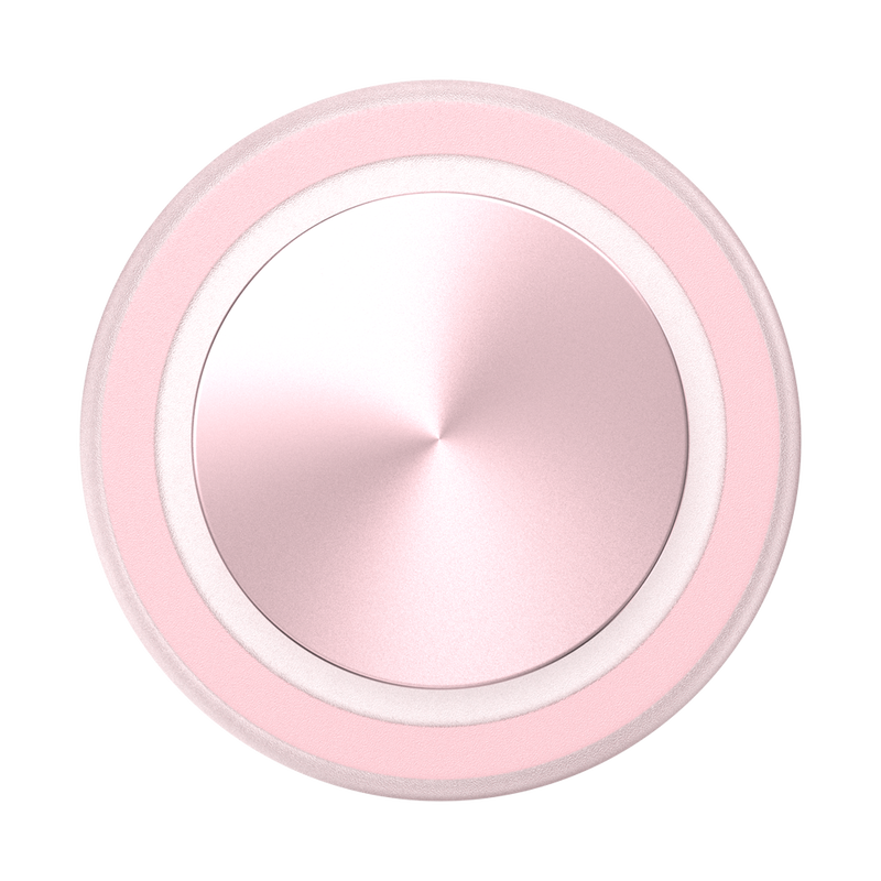 A close-up view of a PopSockets MagSafe PopGrip in dusty rose color is shown. The grip features a round, flat surface with a glossy, slightly reflective finish. The soft pink color and the concentric circular design give the PopGrip a sleek and modern appearance, emphasizing its elegant and functional design.