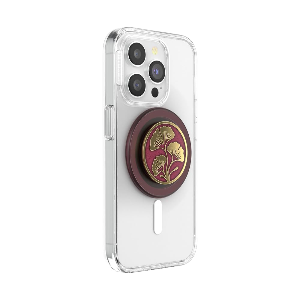 This image shows a **clear phone case** with a **luxurious PopSocket** featuring a **golden ginkgo leaf design** on a rich **maroon background**. The PopSocket is attached to a **magnetic base**, providing both a stylish aesthetic and functional grip or stand for the phone. The case and PopSocket combination highlights a balance between elegance and practicality, making it a fashionable phone accessory.