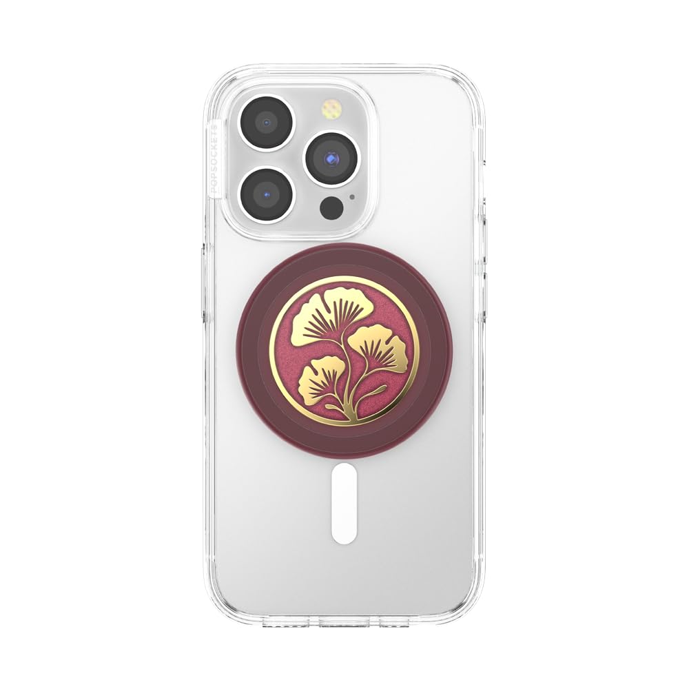 This image features a clear phone case with a **PopSocket** attachment displaying a **golden ginkgo leaf design** set against a **rich maroon background**. The combination of the elegant gold detailing and deep red tones gives it a premium, sophisticated look while serving as a functional accessory for improved phone grip and stand capability.