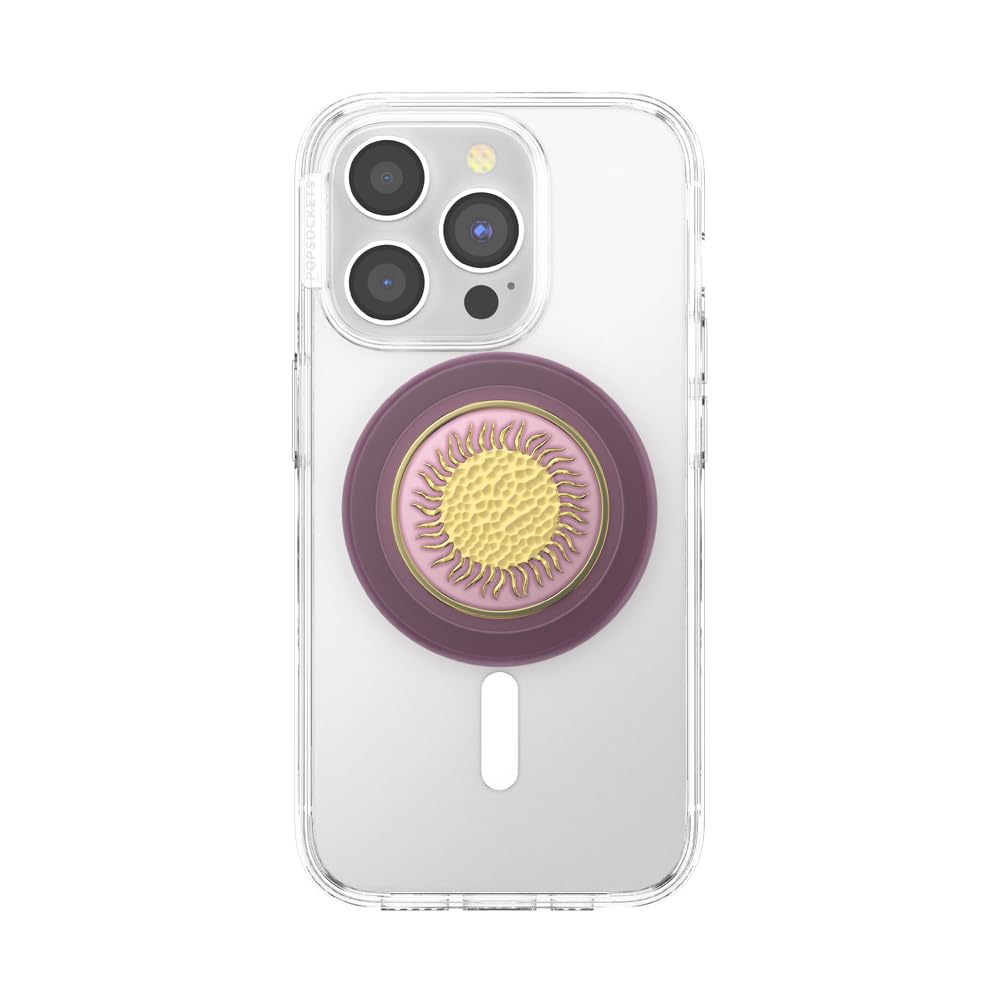 The phone features a clear case adorned with a PopSocket that has a vibrant purple and gold sunburst design, creating an eye-catching aesthetic while offering enhanced grip and functionality.