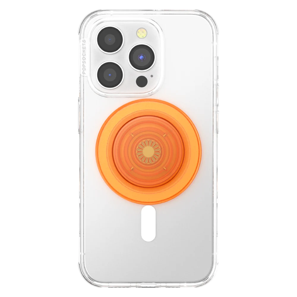 A clear phone case is shown attached to a smartphone with a PopSockets MagSafe PopGrip in the Orange Zest color. The PopGrip, featuring a sunburst design, is centered on the back of the phone case, providing a secure and convenient hold for the device