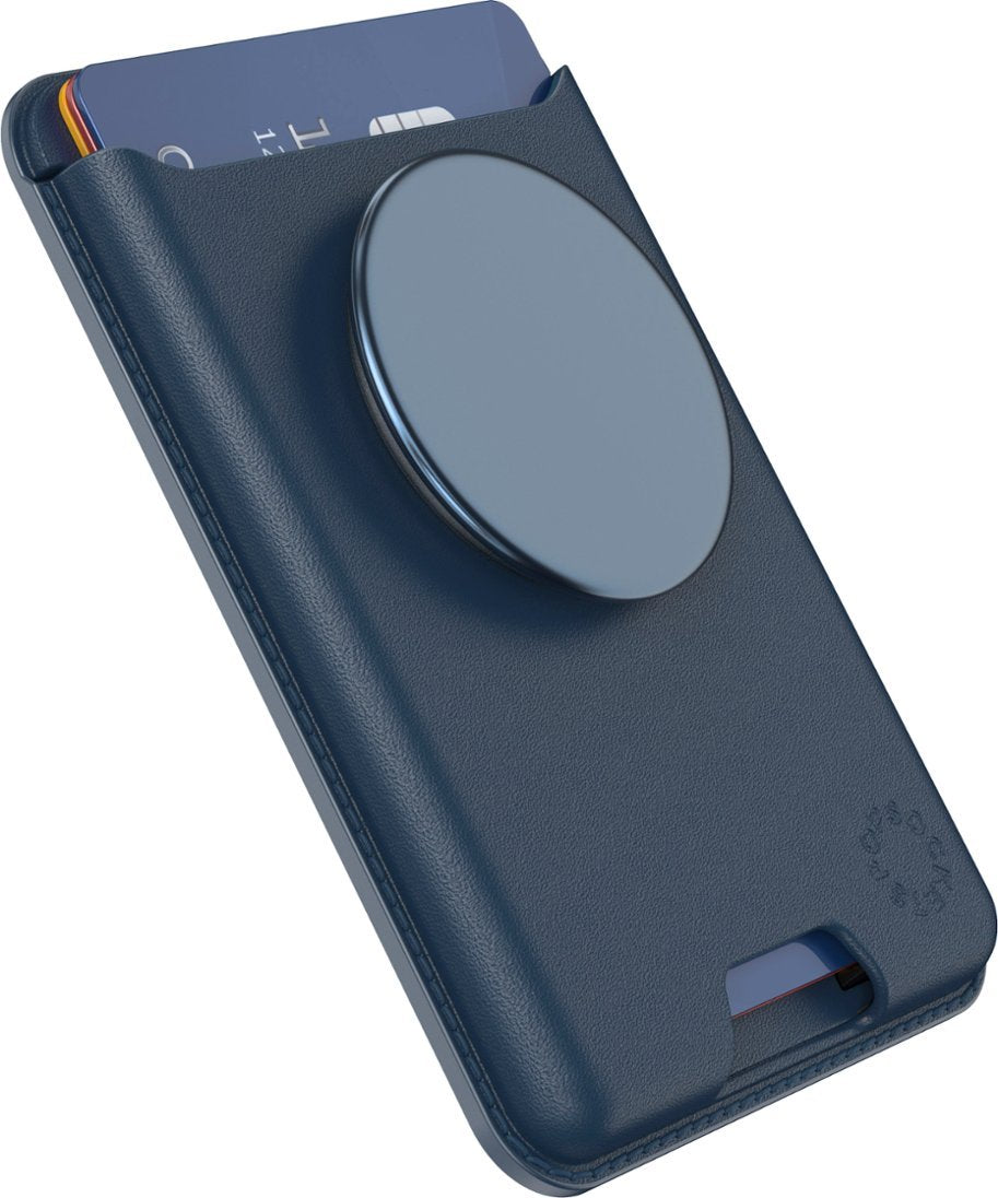  A navy blue leather PopSockets MagSafe Softgoods PopWallet attached to a phone. The wallet has a circular PopSocket on the back and a card partially inserted into the card slot. The PopWallet has a sleek and smooth texture, with subtle branding on the lower right corner.