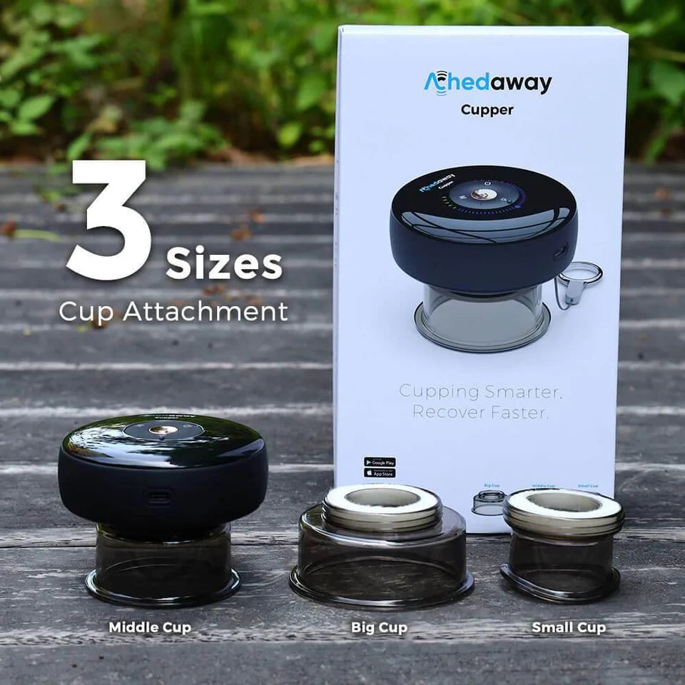 Achedaway Cupper device with packaging, showcasing three cup attachment sizes: middle, big, and small. The product packaging displays the tagline "Cupping Smarter. Recover Faster." The image highlights the versatility of the device for different therapy needs, with app control options available as indicated by the mobile app icons on the box. The setup is displayed outdoors on a wooden surface with a green background.