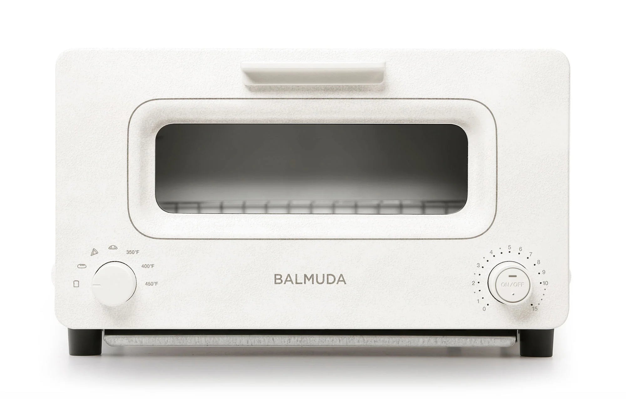 The image shows a front view of the Balmuda toaster in a clean, matte white finish. The toaster features a large rectangular viewing window, bordered by a subtle white accent. The brand name "BALMUDA" is centered in silver lettering below the window