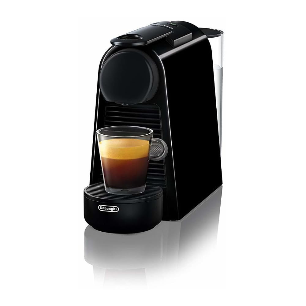 A sleek black espresso machine with a compact design, brewing a freshly made espresso in a transparent glass, showcasing its rich brown coffee and golden crema on top.