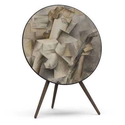 Bang & Olufsen speaker with a skin cover featuring a Cubism design, showcasing abstract geometric shapes in muted tones, mounted on a tripod stand