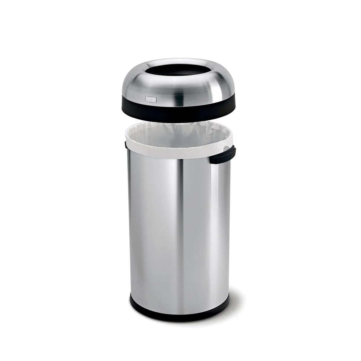 The image shows a large, cylindrical stainless steel trash can with a dome-shaped lid that has been removed and positioned above the can. The lid features a wide, circular opening for easy waste disposal and has a black band around its edge. The body of the trash can is made of polished stainless steel, with a white trash bag neatly lining the interior. The design is modern and functional, making it ideal for use in high-traffic areas such as kitchens, commercial spaces, or public areas. The removable lid a