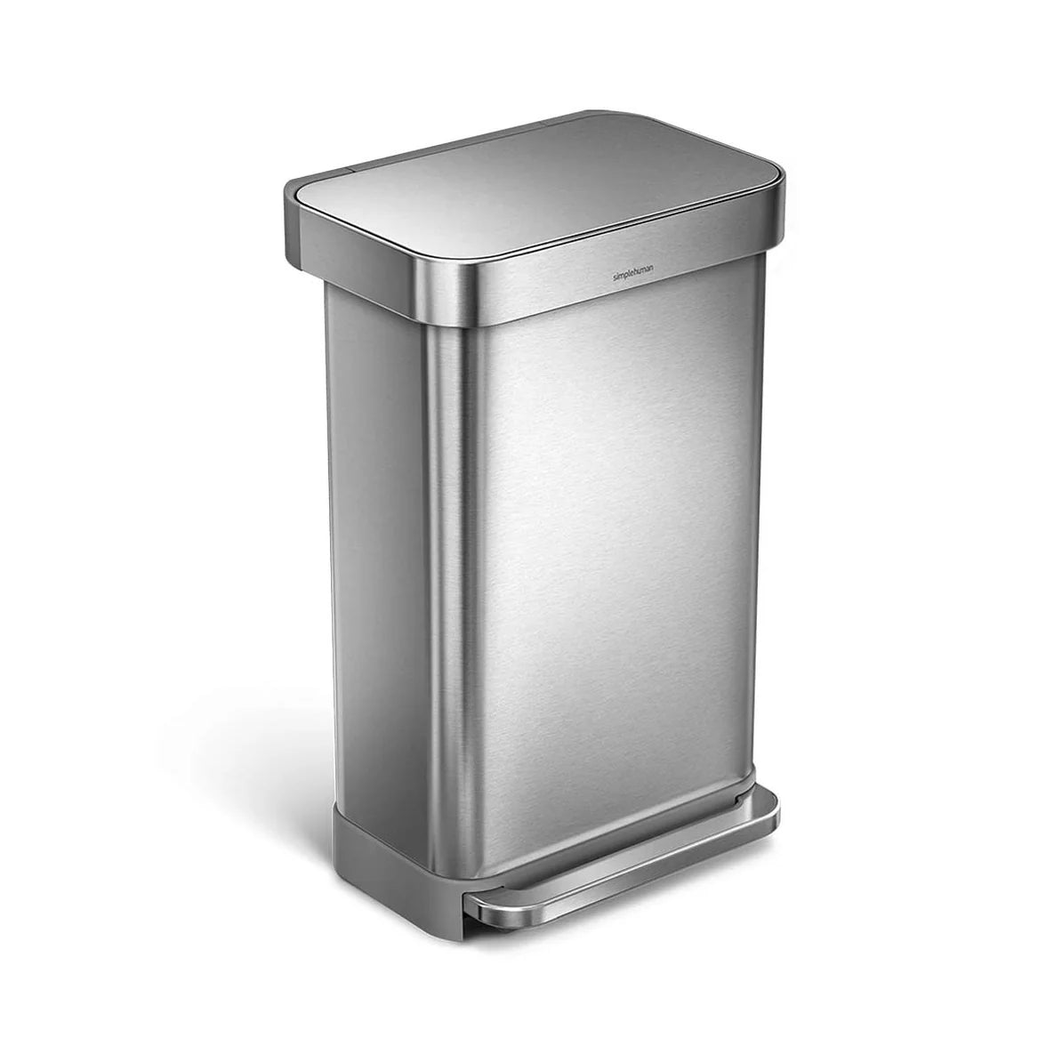 The image shows a Simplehuman trash can with a brushed stainless steel finish, viewed from an angled perspective. The trash can has a rectangular shape with slightly rounded corners, giving it a sleek and modern appearance. The lid is closed, and the overall design emphasizes clean lines and a minimalist aesthetic. The foot pedal at the base, also made of brushed stainless steel, allows for hands-free operation and matches the rest of the trash can's design. This trash can is designed to blend seamlessly in