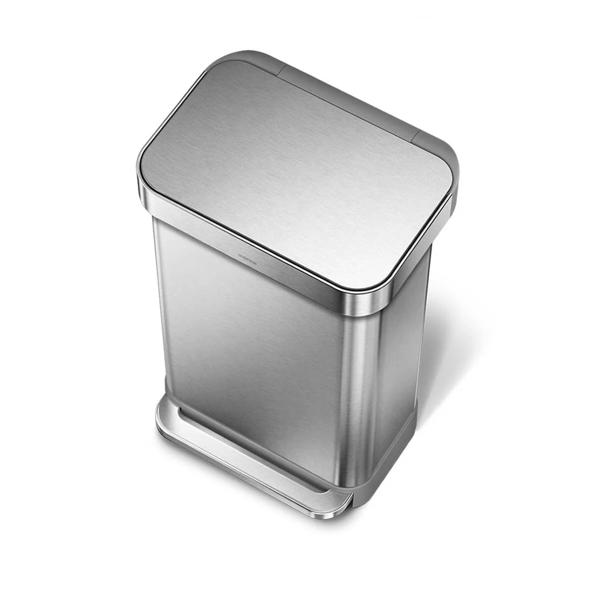 The image shows a top-down view of a Simplehuman trash can with a brushed stainless steel finish. The trash can has a rectangular shape with rounded corners, and the lid is closed, showcasing the sleek and seamless design of the can. The brushed stainless steel body and lid provide a modern and sophisticated appearance, while the foot pedal at the base, also made of brushed steel, enhances the functional and aesthetic aspects of the design. This perspective highlights the trash can's compact, clean lines, m