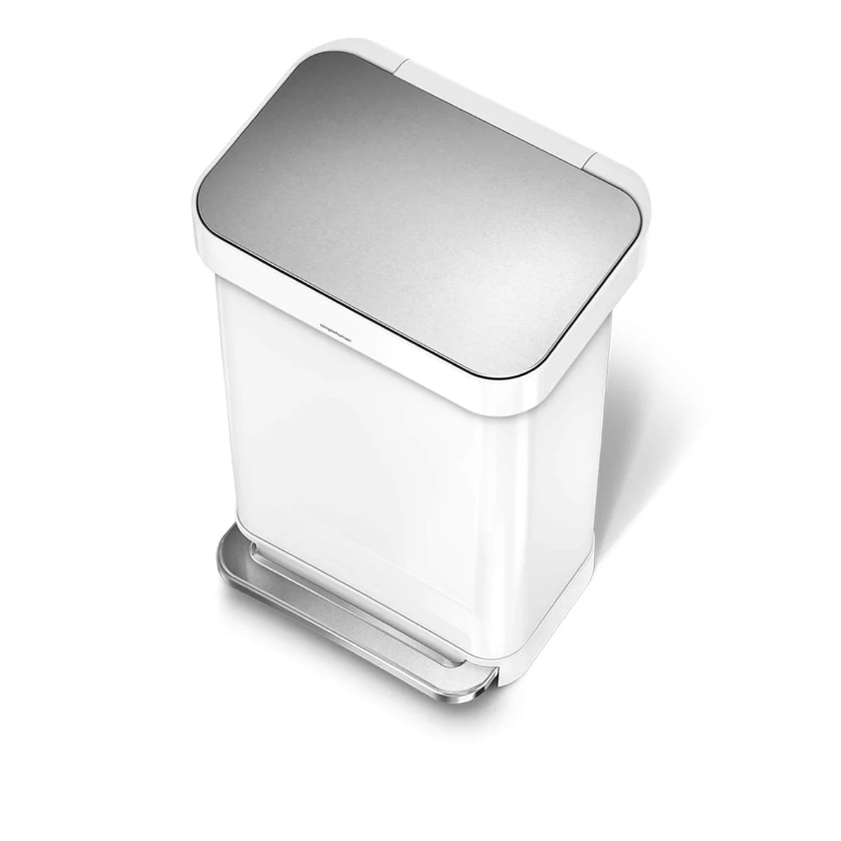 The image shows a top-down view of a white Simplehuman trash can with a closed lid. The trash can has a rectangular shape with rounded edges, and the lid features a metallic, brushed steel finish that contrasts elegantly with the white body of the can. The foot pedal at the base, also made of brushed steel, is visible and complements the lid’s finish, adding a touch of sophistication to the overall design. This perspective highlights the trash can's compact, clean, and minimalist design, making it an attrac