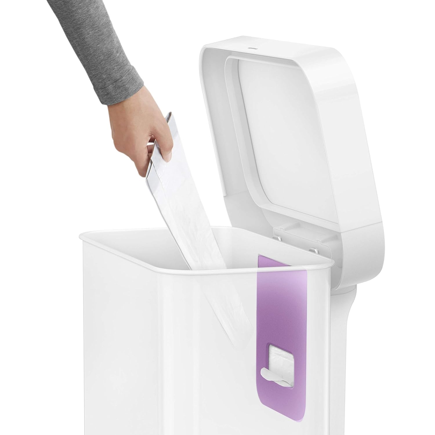 An image showcasing the inner compartment of a Simplehuman trash can, with a user placing a liner refill pack into a convenient internal liner pocket. The trash can lid is open, revealing a sleek and functional design, which allows for easy and organized access to trash bag replacements. This innovative feature simplifies the process of changing liners, making it efficient and user-friendly.