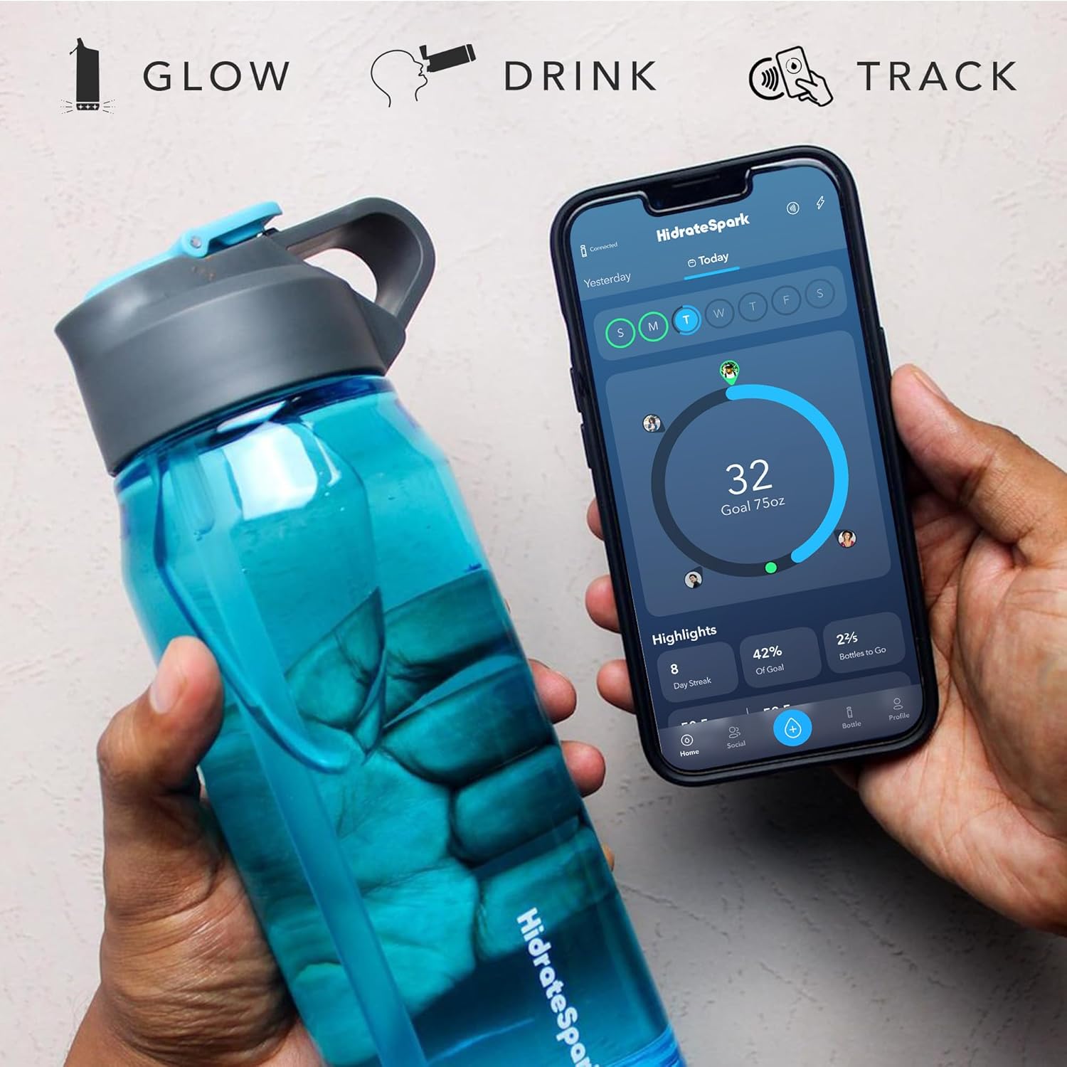 This image features a close-up view of a hand holding a HidrateSpark smart water bottle, which is filled with water and has a built-in glowing light feature. Another hand is holding a smartphone displaying the HidrateSpark app, showing hydration tracking with a circular progress graphic and goal statistics. The text "Glow, Drink, Track" at the top emphasizes the smart bottle's features: glowing reminders, drinking to stay hydrated, and tracking daily water intake via the app.