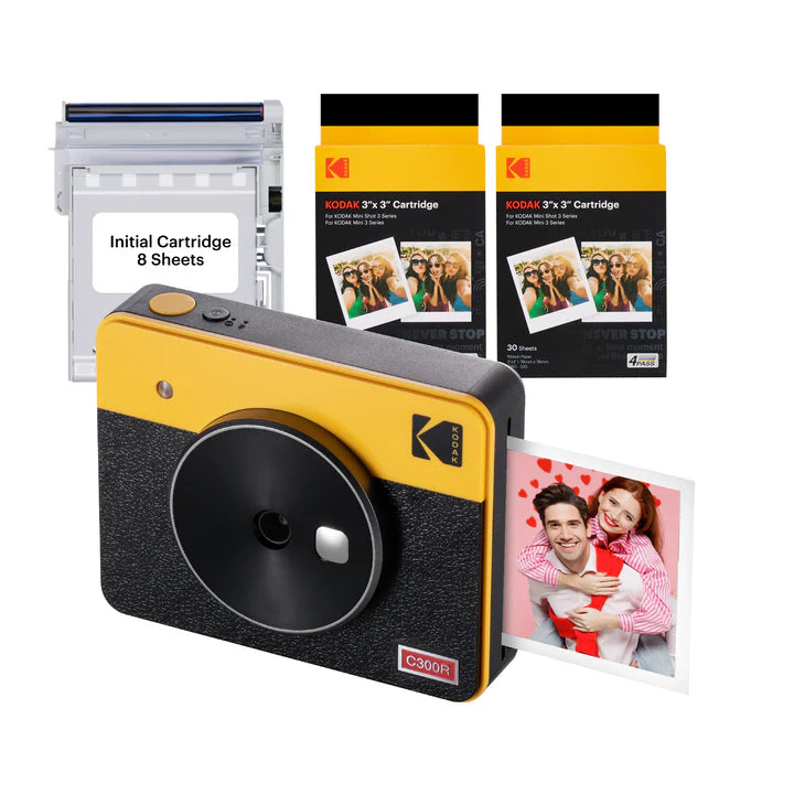 A Kodak C300R instant camera bundle includes the camera, an initial cartridge with 8 sheets, and two additional 30-sheet cartridges for instant photo printing.