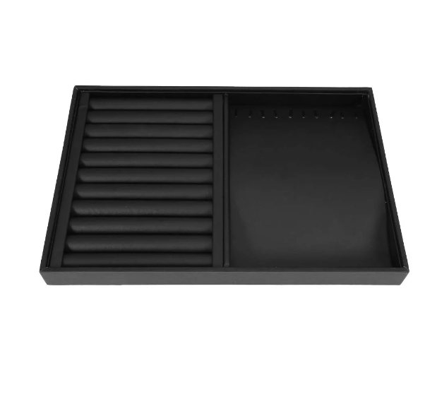 Empty black jewelry organizer tray with ring slots and a section for necklaces or bracelets.