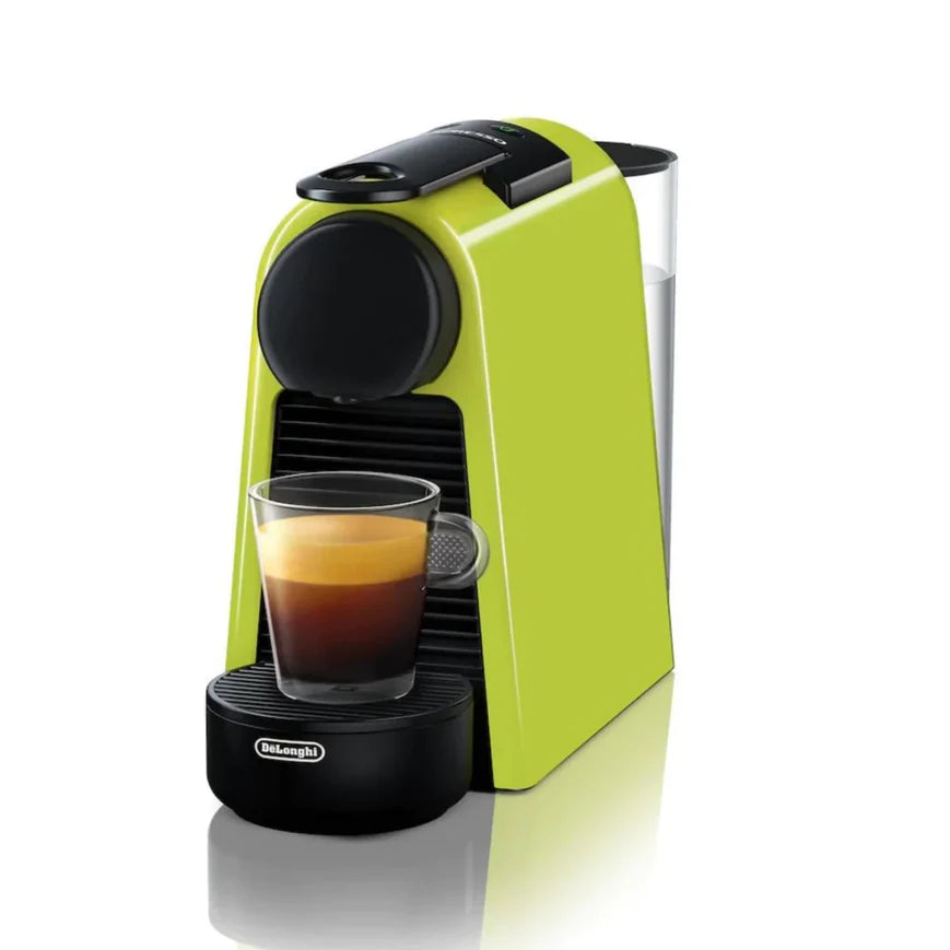 A vibrant lime-green espresso machine with a compact, modern design, featuring a glass of freshly brewed espresso with a smooth golden crema on top, sitting on the machine's drip tray.