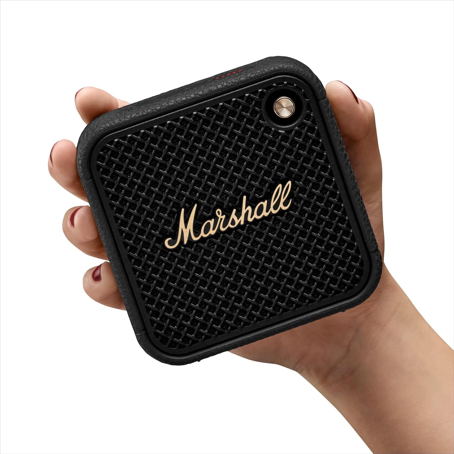 Marshall portable Bluetooth speaker held in hand, showcasing its compact size and signature vintage design.