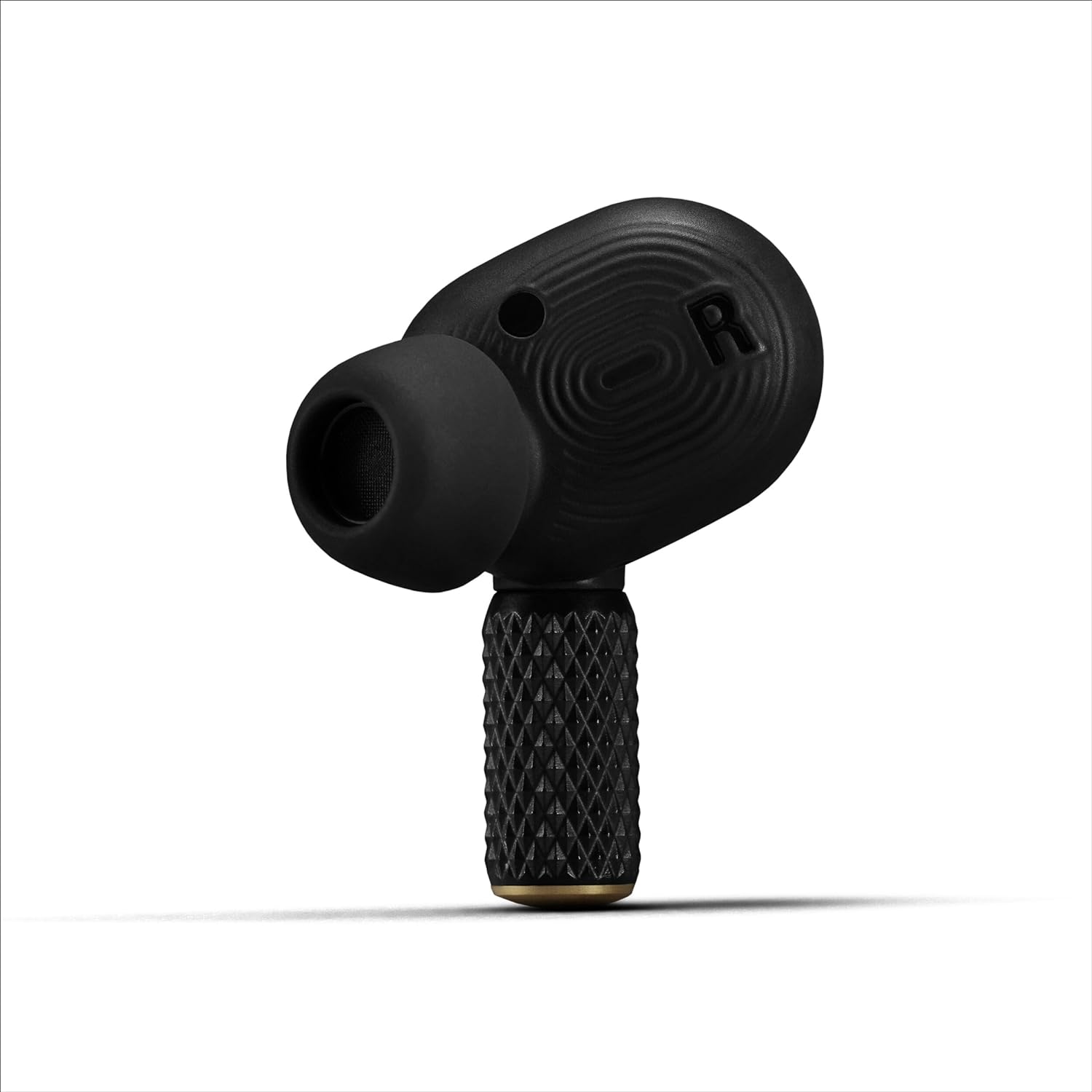 "Close-up of Marshall Motif II A.N.C. True Wireless earbud, showcasing textured design and premium build quality for immersive sound experience."