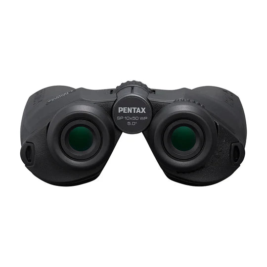 A front view of Pentax SP 10x50 WP binoculars showing the eyepiece lenses. The central focusing wheel, labeled with "PENTAX SP 10x50 WP 5.0°," is prominently visible. The binoculars have a rugged design with textured surfaces for a secure grip. The eyecups are designed for comfortable viewing, and the overall design emphasizes durability and ease of use.