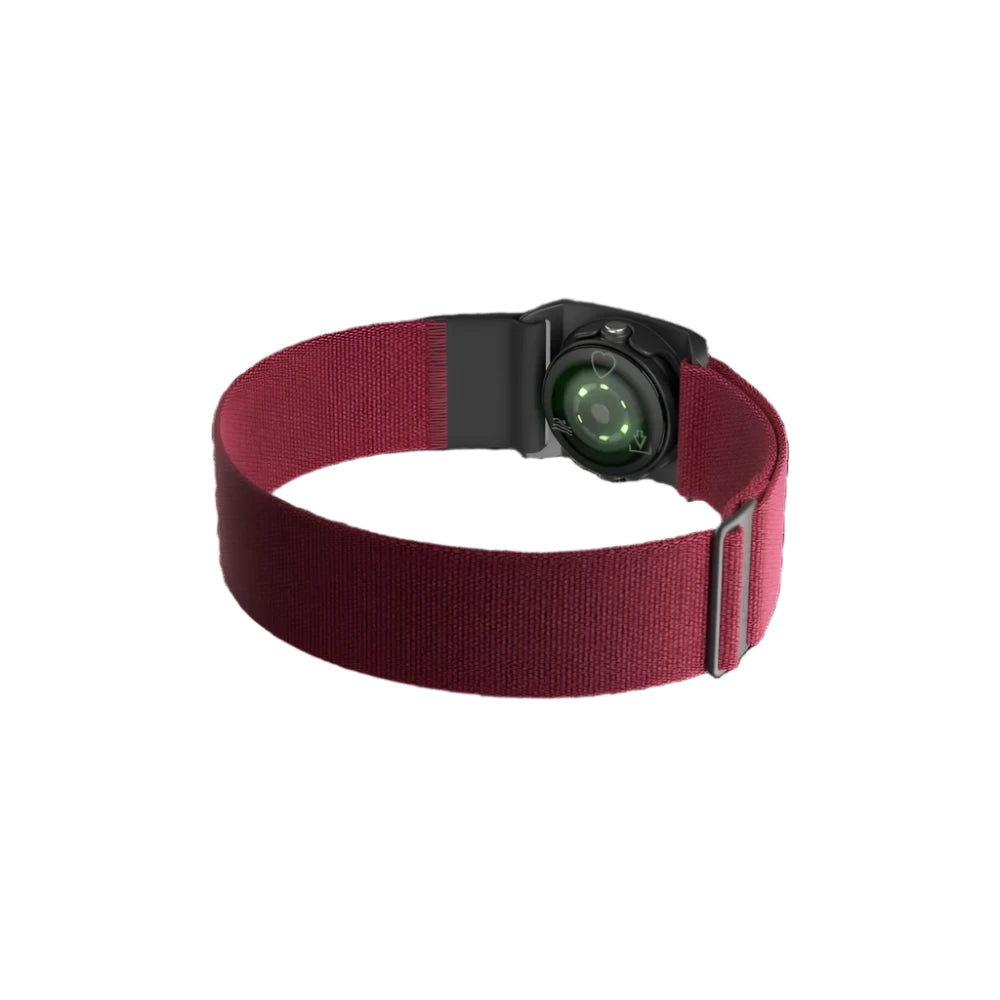  A Polar optical heart rate sensor with a black casing and a red adjustable strap. The sensor's back side is visible, showing the green optical heart rate monitoring lights. The strap is designed for secure fitment around the chest, with an adjustable buckle for a customized fit.