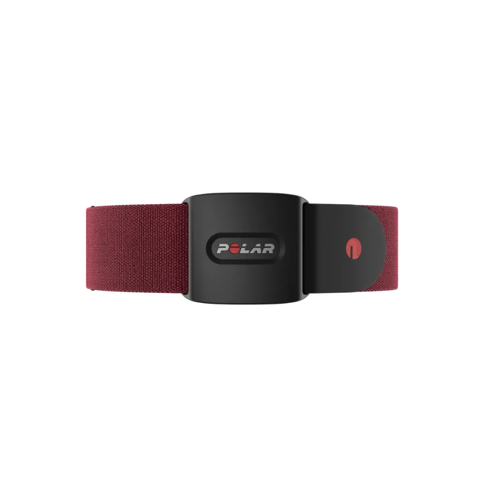 A Polar optical heart rate sensor with a black casing and a red adjustable strap. The front of the sensor features the Polar logo and a red power button on the casing. The strap is designed for secure fitment around the chest and includes an adjustable buckle for a customized fit.