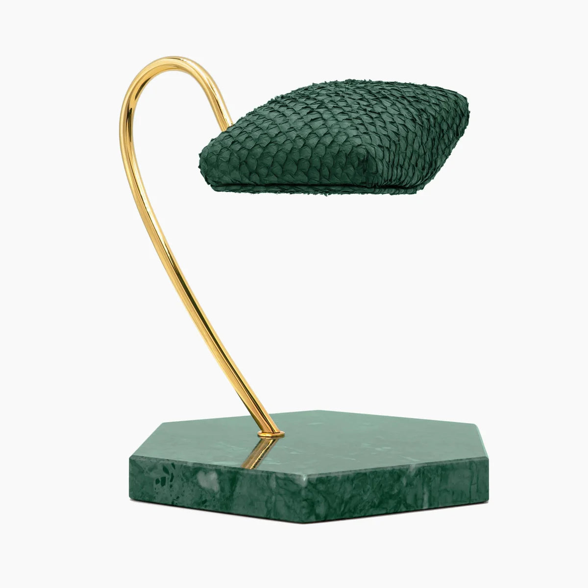 An elegant display stand featuring a green textured cushion mounted on a gold curved support. The base of the stand is made of green marble, shaped in a hexagonal form. The design is minimalist and luxurious, ideal for showcasing a wristwatch or similar item. The gold and green color scheme adds a touch of sophistication to the display.