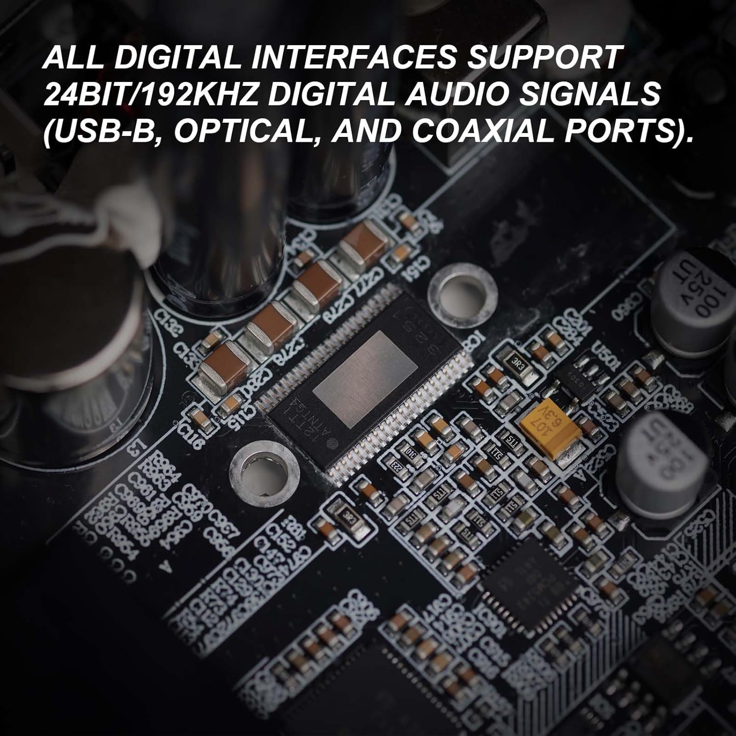 Close-up image of a high-quality audio circuit board, highlighting components that support 24-bit/192kHz digital audio signals via USB-B, optical, and coaxial ports, emphasizing advanced digital interfaces.