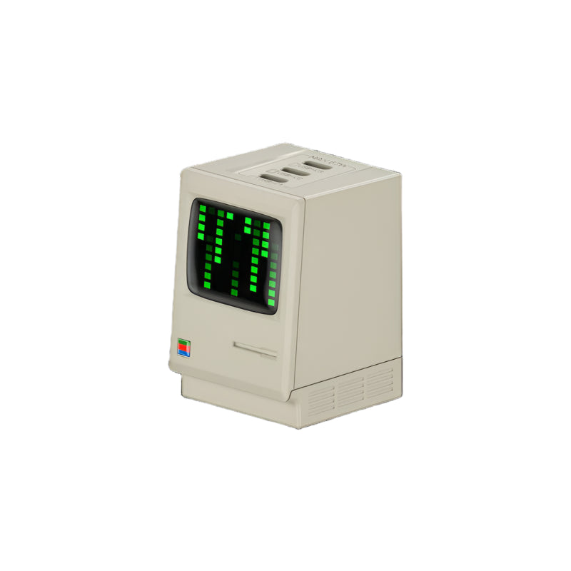 Retro-style USB charger designed to resemble a vintage computer monitor, featuring a green LED pixel display showing "77." The charger has a beige body with multiple USB ports on top, combining nostalgia with modern charging functionality.