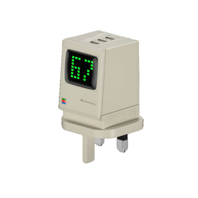 Retro-style USB charger designed to resemble a vintage computer monitor, featuring a digital green LED display showing "67." The charger has a beige body with multiple USB ports on top and a UK-style plug at the base.