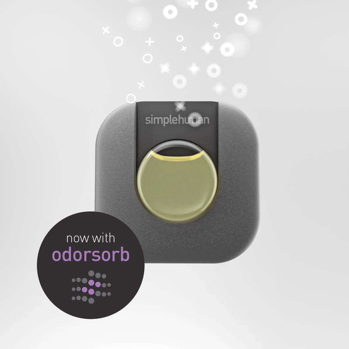 The image shows a Simplehuman product that appears to be an air freshener or filter labeled with "now with Odorsorb." The product is designed to absorb and neutralize odors, as indicated by the visual representation of particles or scent waves emitting from the device. The design is sleek and modern, typical of Simplehuman's aesthetic, with the company name "Simplehuman" clearly visible on the product. The focus is on the feature "Odorsorb," highlighted in the lower left corner in a black circle with the te