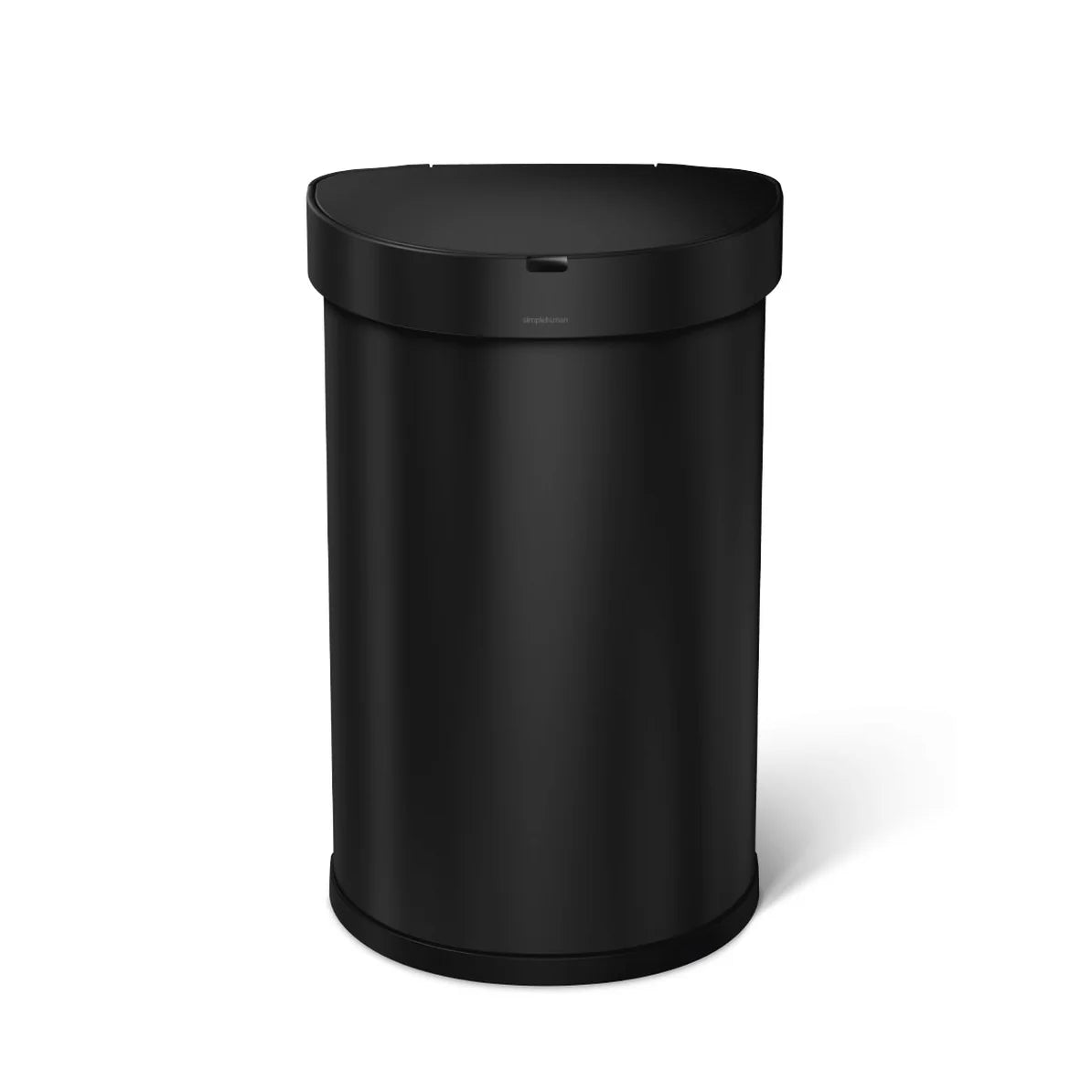 The image shows a Simplehuman black cylindrical trash can with a sleek and minimalist design. The trash can features a smooth, rounded body with a flat top and a motion-activated lid. The black finish gives it a modern and sophisticated appearance, making it a stylish and functional addition to any space. The sensor mechanism allows for hands-free operation, enhancing both convenience and hygiene.