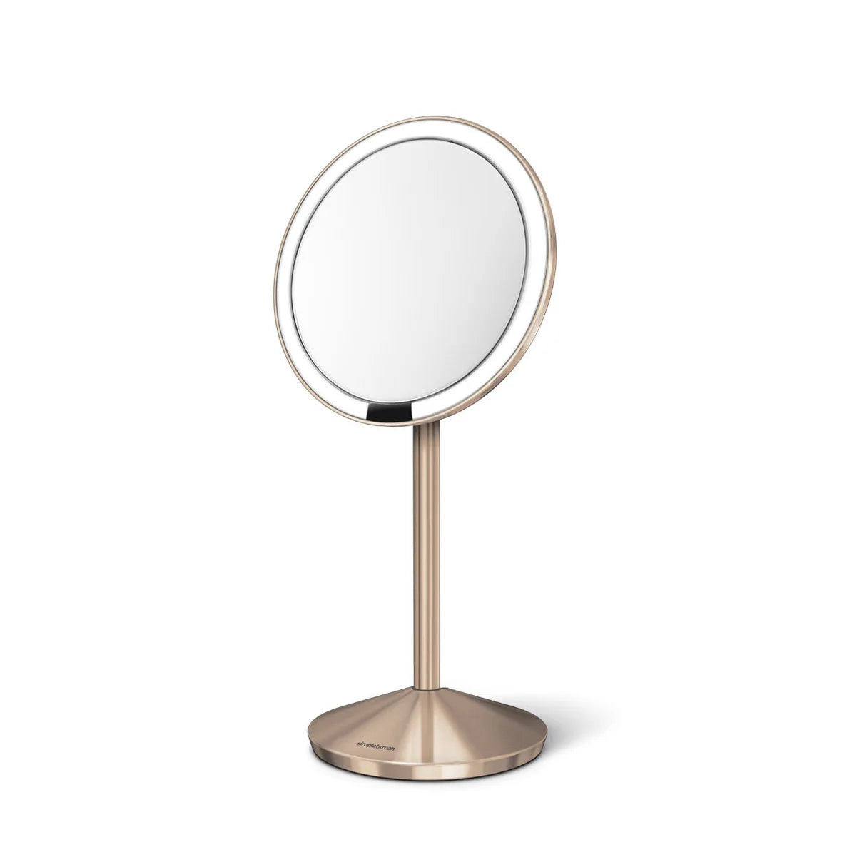  A sleek, circular vanity mirror mounted on a slim, metallic stand with a brushed gold finish. The mirror features a thin bezel and a reflective surface that provides a clear and accurate view. The base of the stand is weighted and has a matching brushed finish, ensuring stability. The overall design is modern and elegant, making it suitable for a contemporary vanity setup.