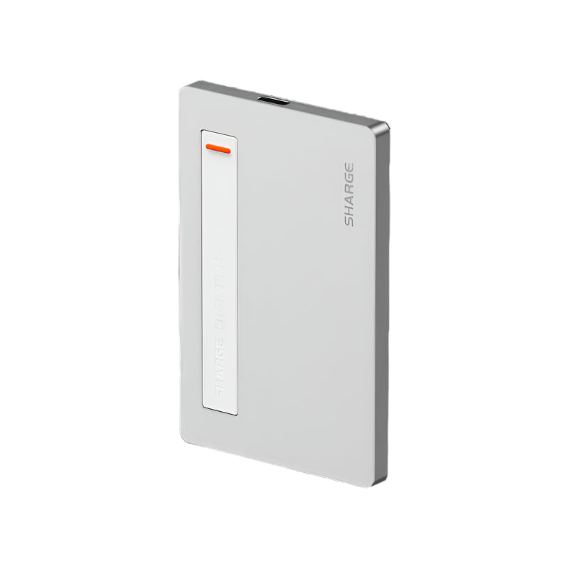 Slim and compact SHARGE power bank with a sleek metallic finish, featuring a built-in white accent strip with an orange indicator light, emphasizing its modern and minimalist design ideal for portability.