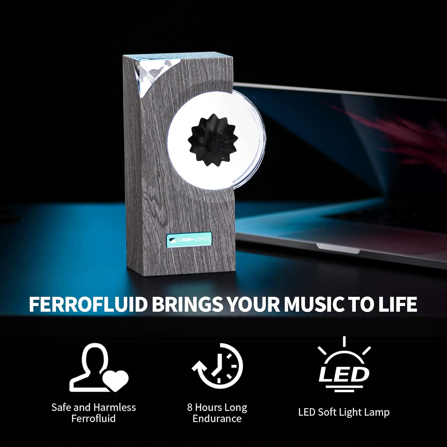 The image features the "Ferrofluid Music Mate One" displayed alongside a laptop, highlighting the product's modern and interactive design. The text on the image emphasizes the product's capability to "Bring Your Music to Life" by visualizing sound through ferrofluid. Key features highlighted include the use of safe and harmless ferrofluid, an 8-hour long endurance, and an LED soft light lamp, making it a visually engaging and functional addition to any music enthusiast's setup.