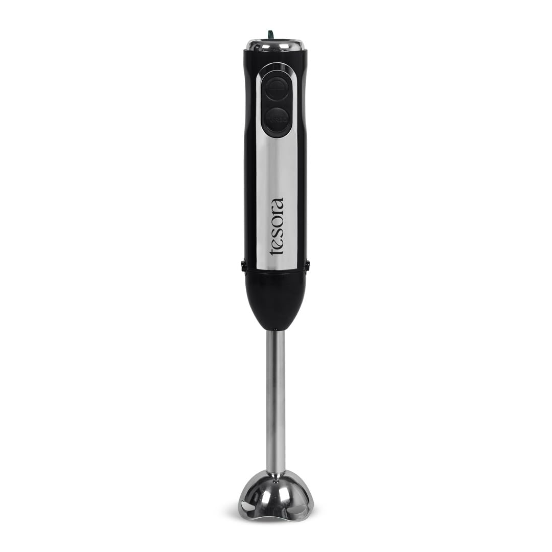 This image features the **Tesora hand blender**, a sleek and modern kitchen appliance. The hand blender is designed with a polished stainless steel blending arm and a compact, ergonomic handle, making it ideal for blending smoothies, soups, and sauces. Its minimalist design emphasizes functionality, with two accessible buttons for easy operation. The Tesora branding on the body adds a professional and stylish touch, making it a reliable and elegant tool for any kitchen.