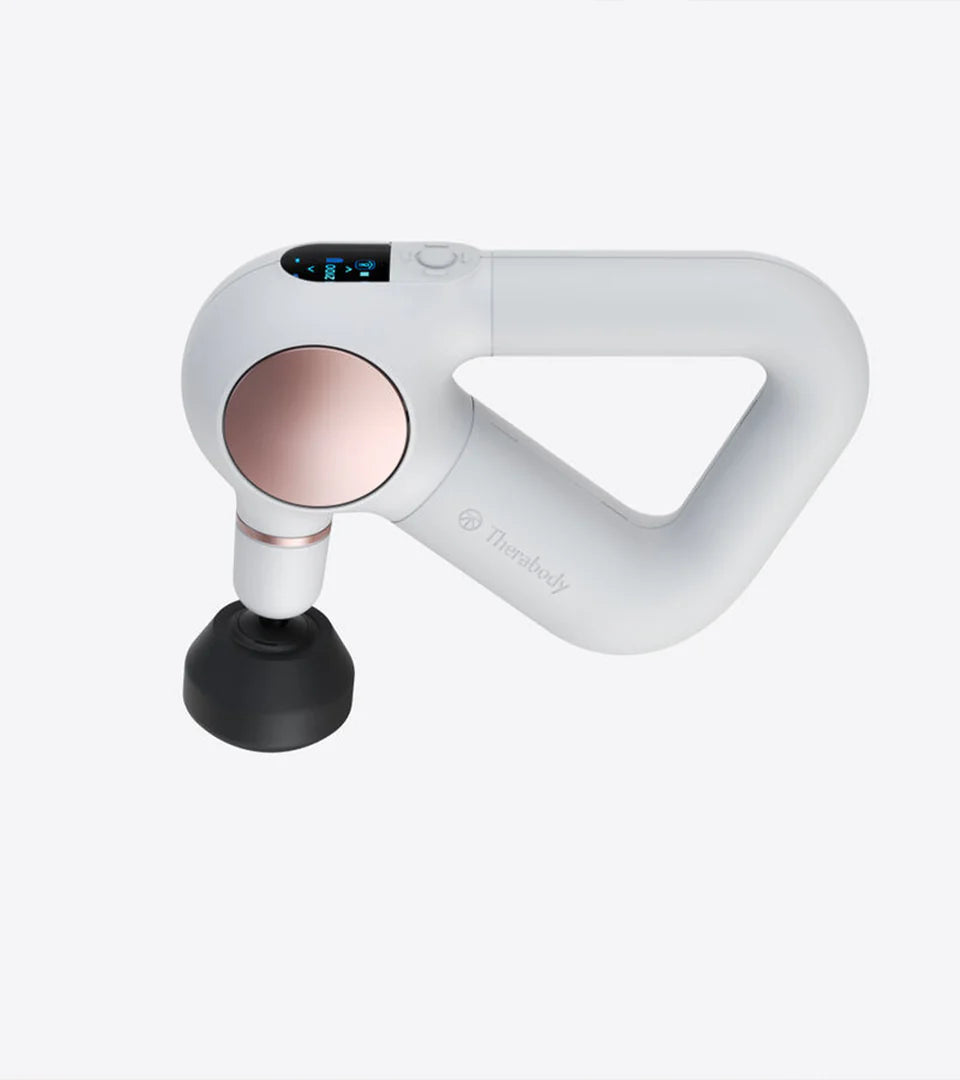 Theragun massage device in elegant white with a rose gold accent, featuring an ergonomic triangular handle and precision attachment for targeted muscle therapy and effective recovery.