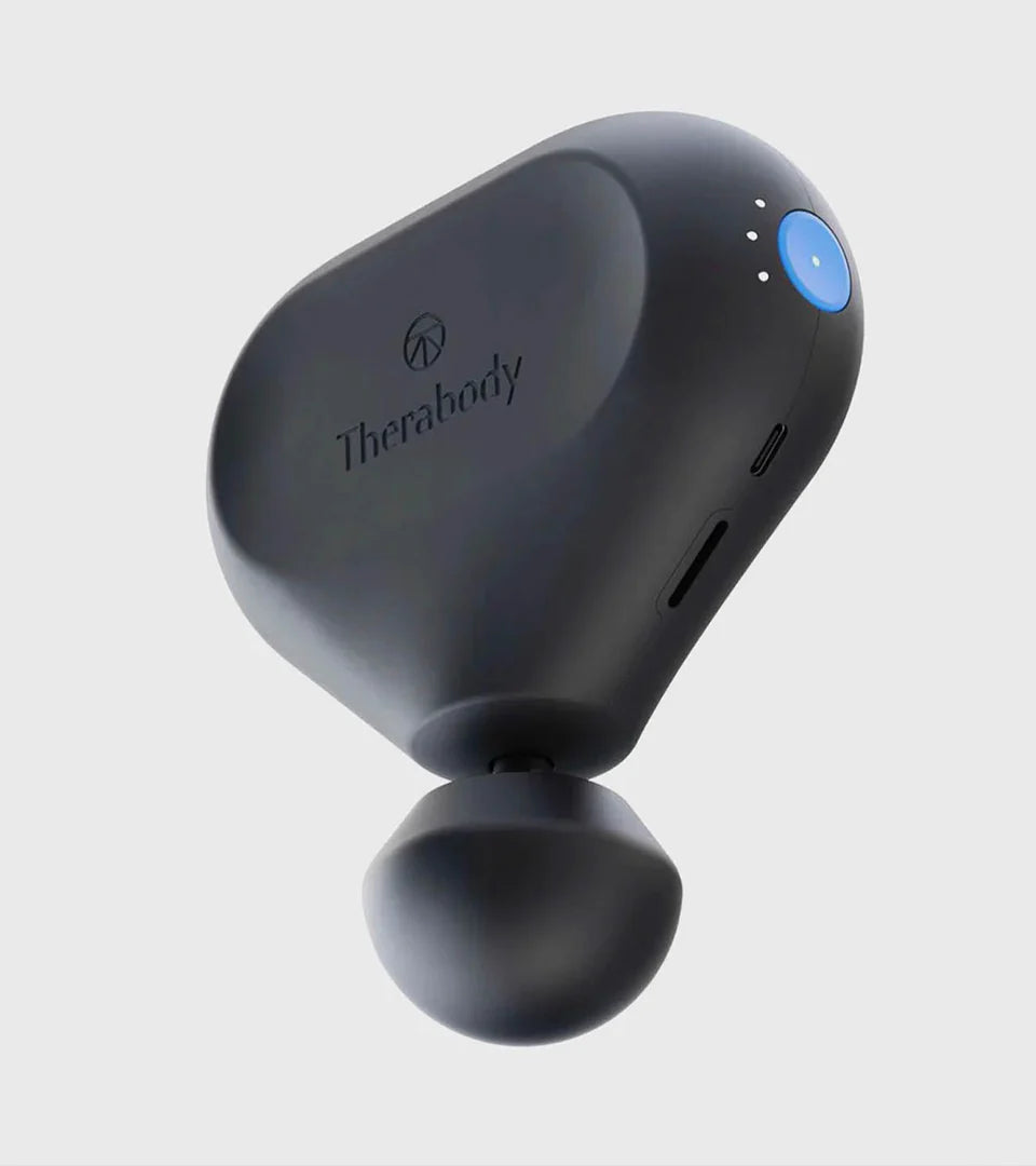 Therabody mini massage device in a sleek black design, featuring a rounded ergonomic shape, a blue power button, and a USB-C charging port. Compact and portable, designed for on-the-go muscle relief and relaxation.