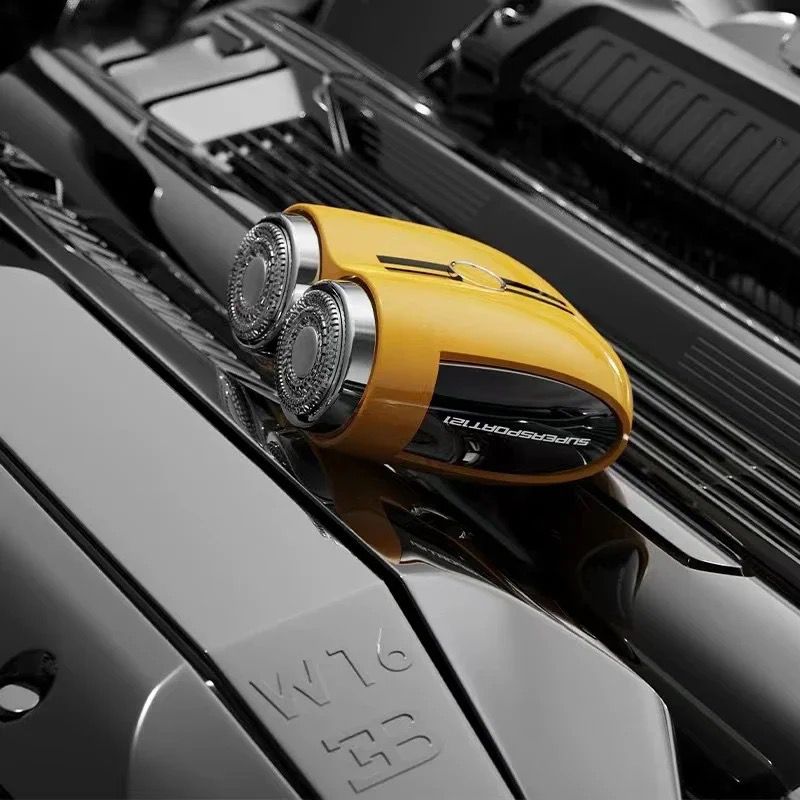 This image features a yellow, dual-head electric shaver with a design that closely resembles a high-performance sports car. The shaver is labeled "SUPRASPORTS" on its side, further reinforcing the sporty and dynamic theme. It is placed on top of a sleek engine, which enhances the comparison to automotive design and suggests power and precision in its operation. The shiny chrome and black accents add to the premium, high-tech aesthetic of the shaver. This presentation likely appeals to users who appreciate c