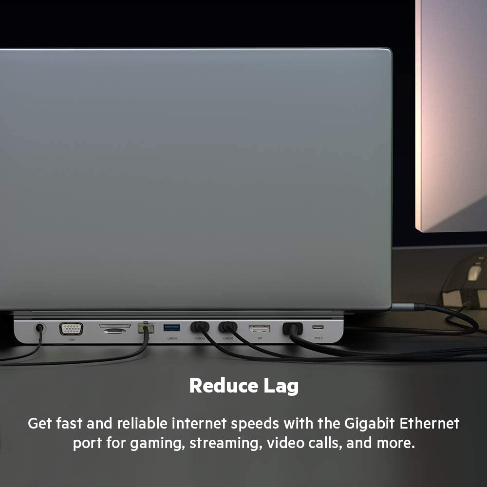 ALT: "Belkin multiport dock connected to a laptop with various cables. The image emphasizes the dock's Gigabit Ethernet port, promoting fast and reliable internet speeds for gaming, streaming, video calls, and more. The text reads 'Reduce Lag' and highlights the benefits of the Ethernet port."