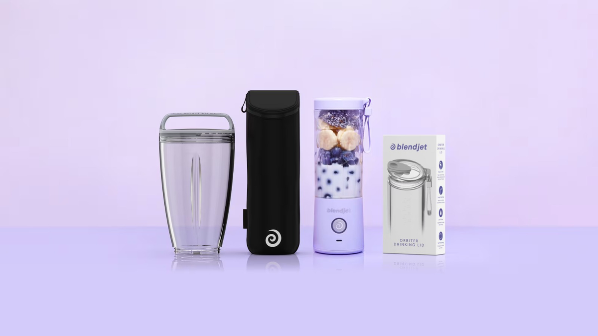 Lavender BlendJet 2 blending berries and banana beside the XL Jar, black Jetsetter Sleeve and boxed Orbiter Drinking Lid