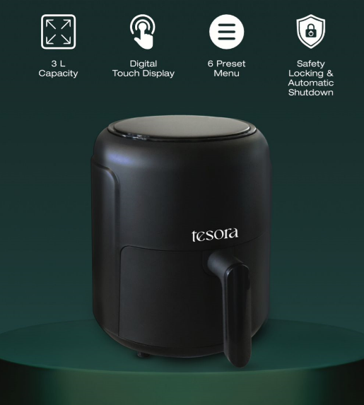 This image showcases a black air fryer from the brand "Tesora" placed on a green platform. The air fryer has a sleek, modern design with a matte finish. The minimalist style, paired with the subtle lighting on the platform, gives it an elegant and premium feel. The design emphasizes functionality with a large handle, likely for easy use. This image appears to be a product showcase or promotional material for the Tesora air fryer.