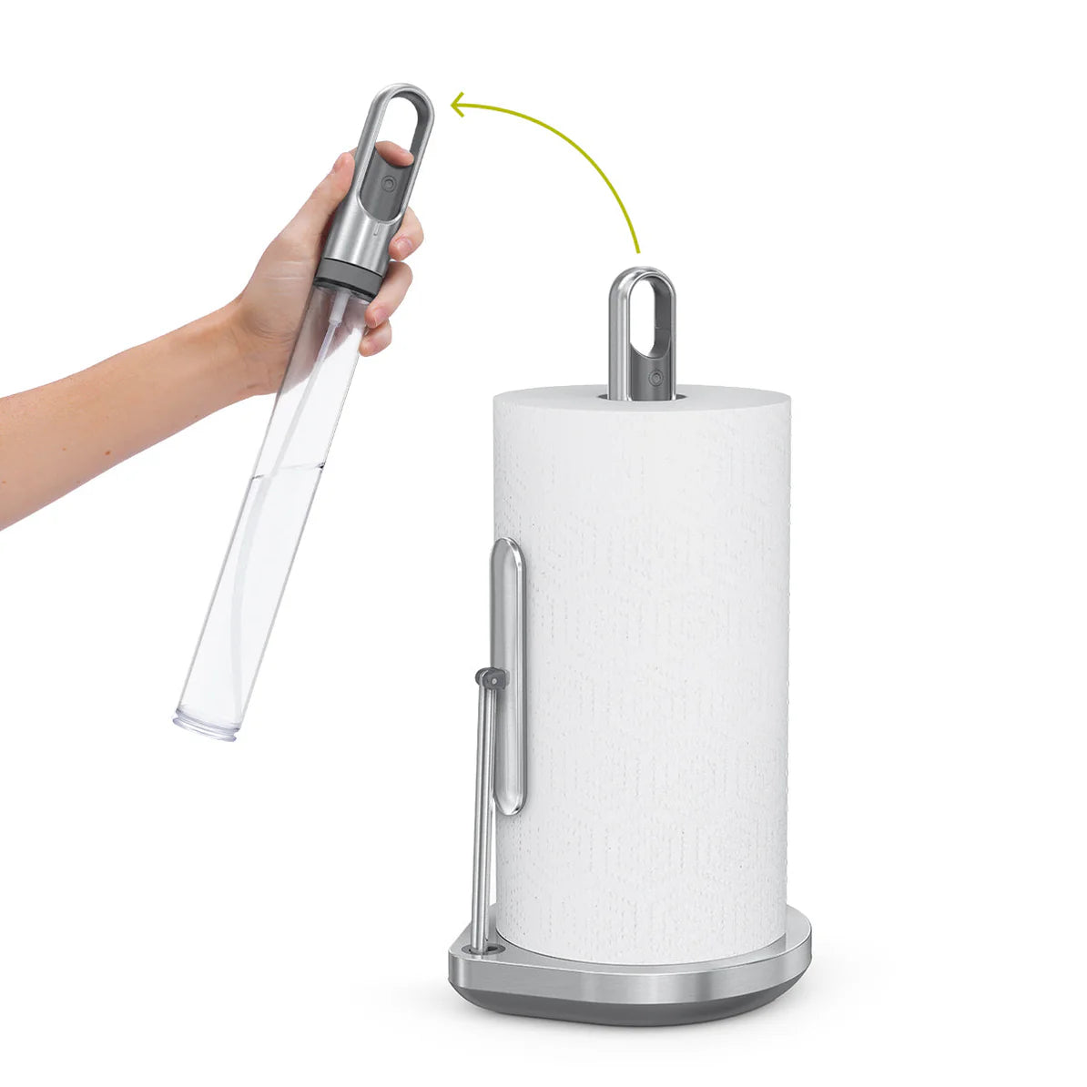 The image shows a modern paper towel holder with a sleek, stainless steel design. The holder features a vertical rod to keep the paper towel roll in place and a weighted base for stability. A unique feature is demonstrated, where the top portion of the rod can be removed, as shown by a hand lifting it out, likely for easy loading of new paper towel rolls. The design is both functional and stylish, making it a practical addition to any kitchen or workspace. The clean lines and polished finish give it a conte