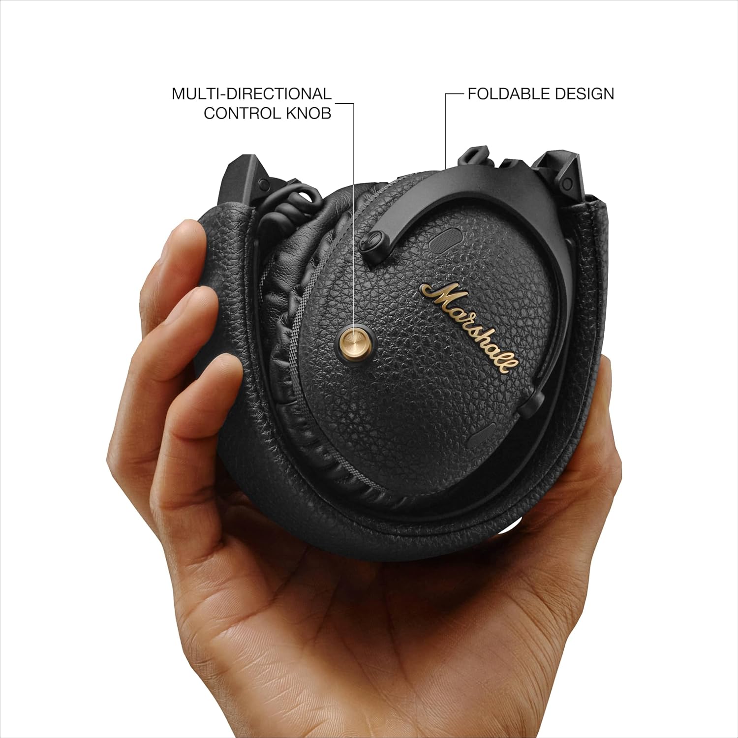 Marshall Monitor III A.N.C. headphones in a folded position, featuring a multi-directional control knob for easy audio adjustments and a compact, portable design.