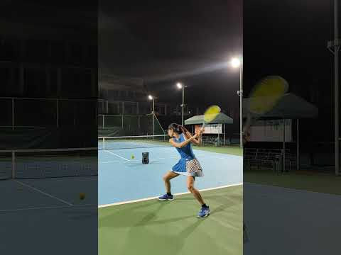 This image is a thumbnail for a video titled "Tennis Training with my PT-Mini Ball Machine," featuring a player using the ball machine for precise tennis practice on a well-lit court.