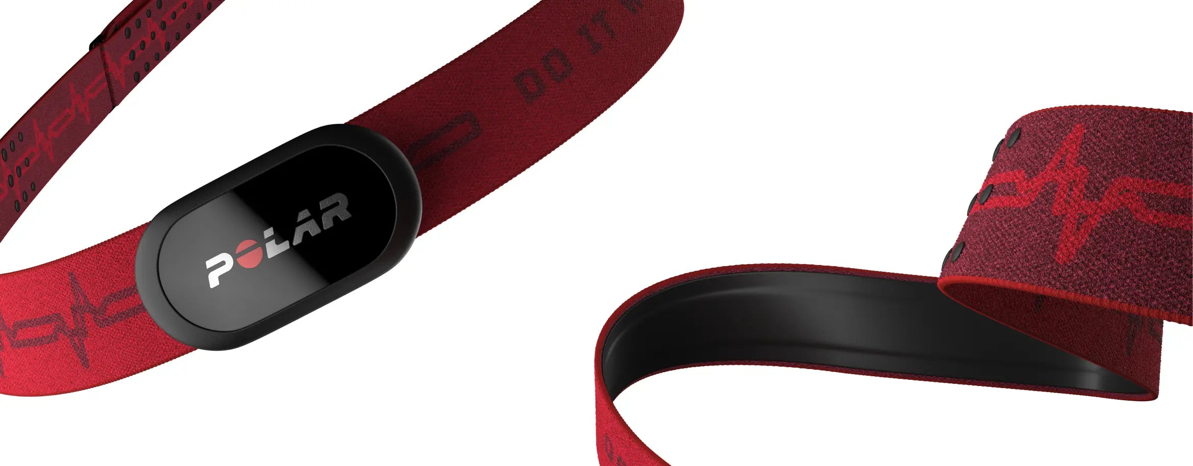 The image shows a close-up of a Polar heart rate monitor strap. The strap is red with black accents, featuring a sleek black sensor module with the Polar logo prominently displayed in the center. The strap includes subtle design elements, such as an EKG line graphic, and is made from a comfortable, elastic material designed to fit securely around the chest. The heart rate monitor is designed for accurate tracking during workouts, providing real-time heart rate data to enhance fitness training.